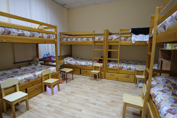 Moscow, Russia - September, 24, 2018: Interior of a kindergarten bedroom with two-level beds in Moscow privet school