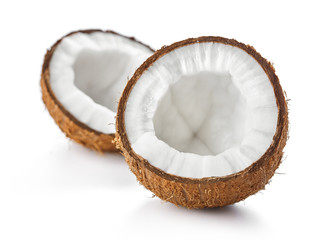 two halves of ripe coconut isolated on white background