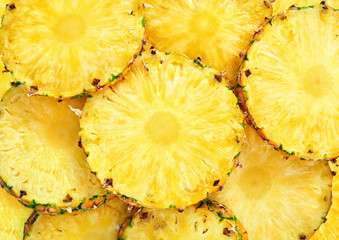 top view of sliced pineapple fruit as textured background - obrazy, fototapety, plakaty