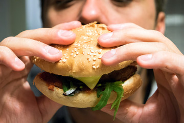 Man eating hamburger