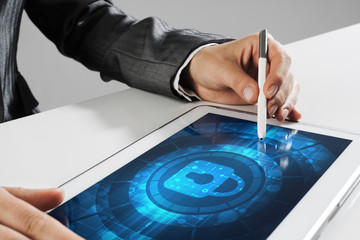 Internet security concept with woman working on media screen with stylus