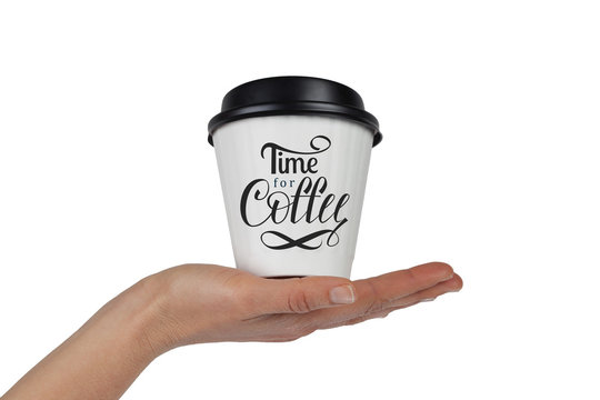 Fototapeta Female hand with white disposable coffee cup in the palm isolated on white with Time For Coffee hand lettering