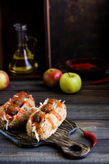 Spicy hot dog with meatballs with apple and cabbage garnish