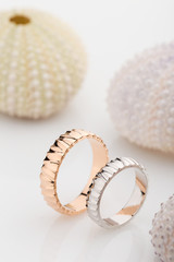 Pair of pink gold and white gold textured wedding rings