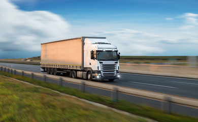 Truck with container on road, cargo transportation concept.
