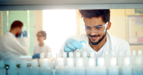 Male student of chemistry working in laboratory