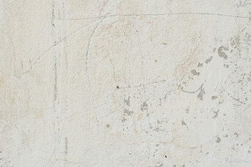 Fototapeta premium Wall fragment with scratches and cracks. It can be used as a background