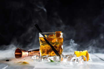Whiskey cocktail with a smoke called smoking gun at the bar - 226470852