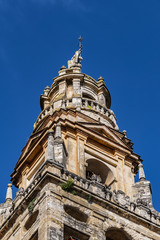 Fototapeta premium Bell tower of Mosque-Cathedral of Cordoba (Mezquita-Catedral de Cordoba), also known as Great Mosque (from 785) of Cordoba or Mezquita, monuments of Moorish architecture. Andalusia, Cordoba, Spain.