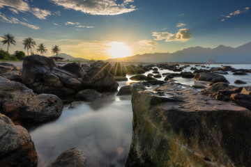 Fototapeta na wymiar Sunset at rocky beach - Nam O - Da Nang - Viet Nam