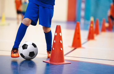 Indoor soccer players training with balls. Indoor soccer sports hall. Indoor football futsal...