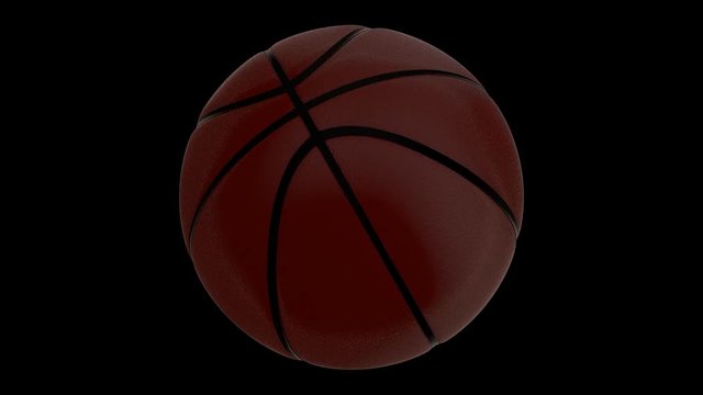 Animated spinning brown basketball against black background. Isolated and loop able. Mask included.