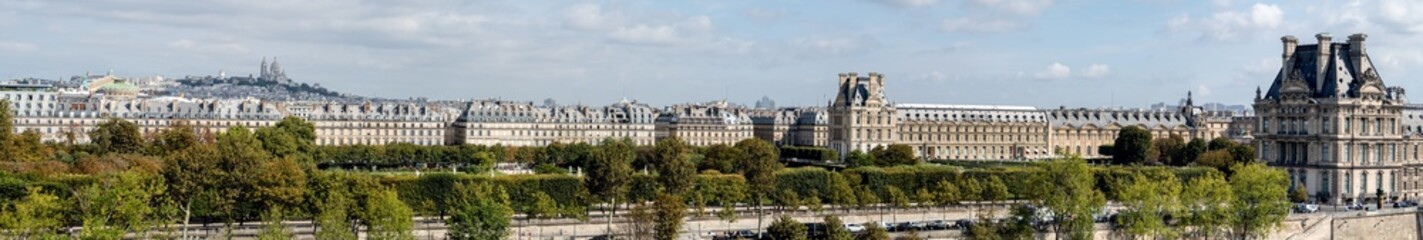 Large panoramic view of Paris from Musee d'Orsay rooftop with the Tuileries Garden, Palais royal,...
