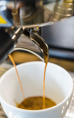Fototapeta na wymiar Barista making a cup of coffee soft focus image .