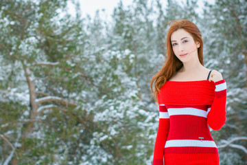 Winter holiday concept. Inspiration and fairy cold time. Woman in fashionable wool  dress and fur coat at park . Pretty nice lady outdoor, holiday days, snowy magical christmas time  