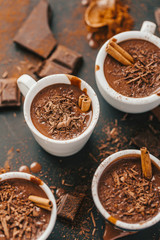 Tasty hot chocolate drink in small cups