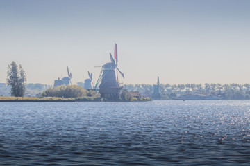 Water landscape with windmills at Zaanse Schans near Amsterdam, Netherlands