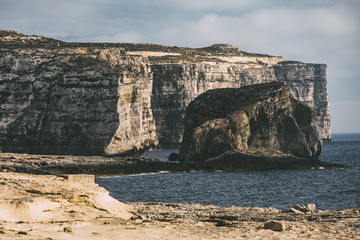 Shoreside cliffs near mediterranean sea in Malta