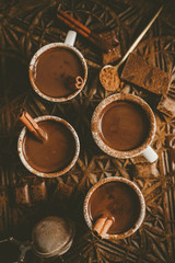 Tasty hot chocolate drink in small cups