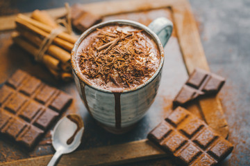 Tasty hot chocolate drink in mugs