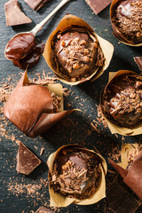 Chcolate muffins on dark table