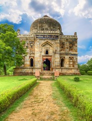 Fototapeta na wymiar Sheesh Gumbad - tomb from the last lineage of the Lodhi Dynasty. It is situated in Lodi Gardens city park in Delhi, India