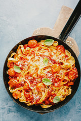 Tomato sauce spaghetti pasta on pan