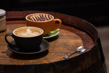 Latte and Cappuccino - Cafe Setting with Old Wood Barrel