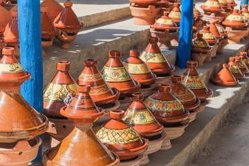 Moroccan tajine pottery for sale at the market in Essaouira, Morocco.