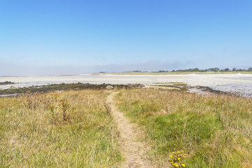 Footpath off the small island of Roc'h Avel close to Landeda beach in Brittany.