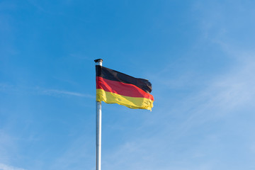 Flag of Germany against the blue sky