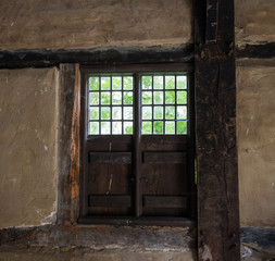 The window of an old farmhouse, inside