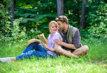 Couple in love spend leisure reading book. Couple soulmates at romantic date. Pleasant weekend. Romantic couple students enjoy leisure with poetry nature background. Romantic date at green meadow