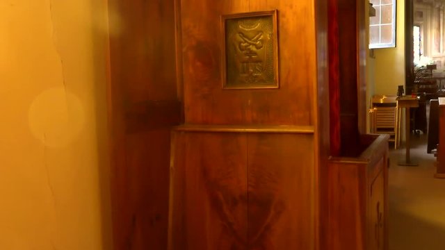 Ancient wooden confessional in Catholic church. zooming shot