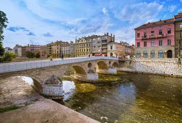 View of Latin Bridge in Sarajevo against cloudy sky