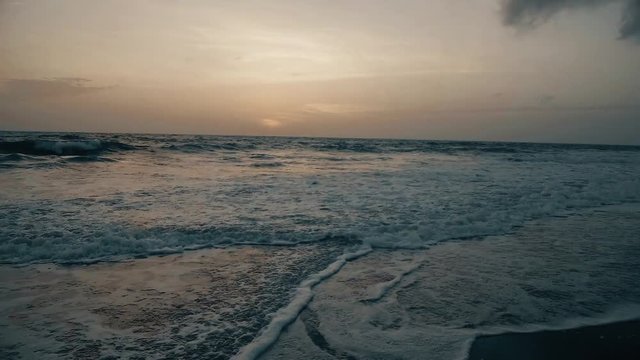 sea surf at sunset