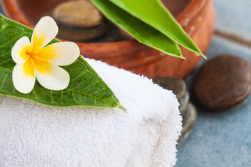 Tropical beautiful natural flower with spa objects on white towel
