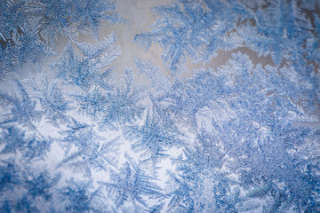 Winter ice pattern on the frozen window. Texture, background for inserting text. New Year theme. Winter. Cold.