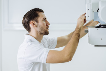 Medical Technician Operating an X-ray Machine