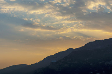 Fototapeta premium Stunning cloudy pink and white sky over Monaco at sunset in summer