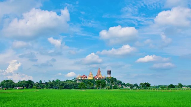 Time lapse white clouds blue sky and green field at Wat thum Sua Kanchanaburi Thailand  travel