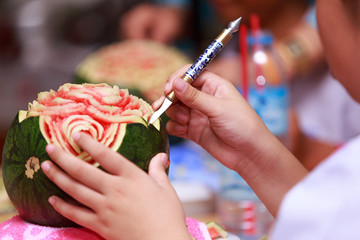 little girl carve fruit