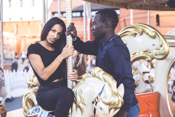 Lovely and cool mixed races couple in the park. Latino woman and african american man who are in love. Relationship. 