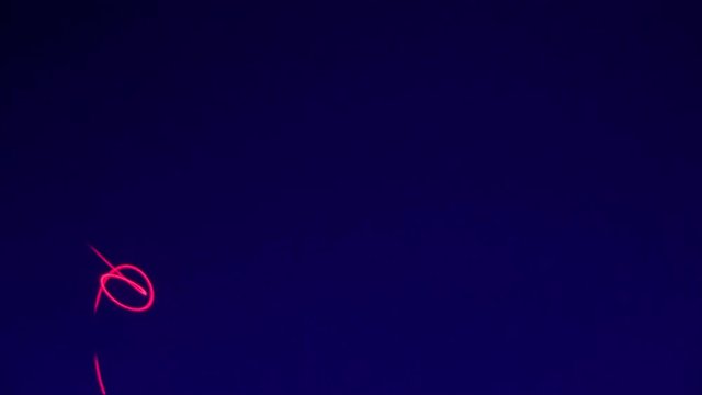 Laser background, ramdom pattern against UV blacklight background. Party concept.