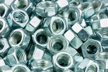 Shiny metal nuts for industrial background