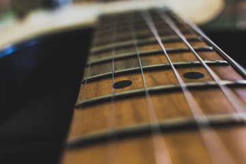 close up of a electric guitar frets