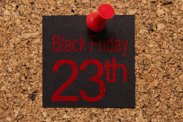 Mural message. Reminder of Black Friday. Red thumbtack. Text: Black Friday 23th