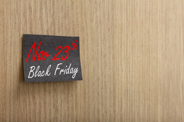 Post it and marketing message of black friday sale on wall.