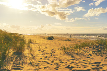 Cyclist rides on the Baltic beach