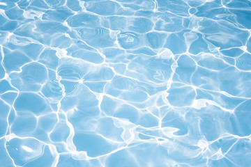 Texture of water in swimming pool for background